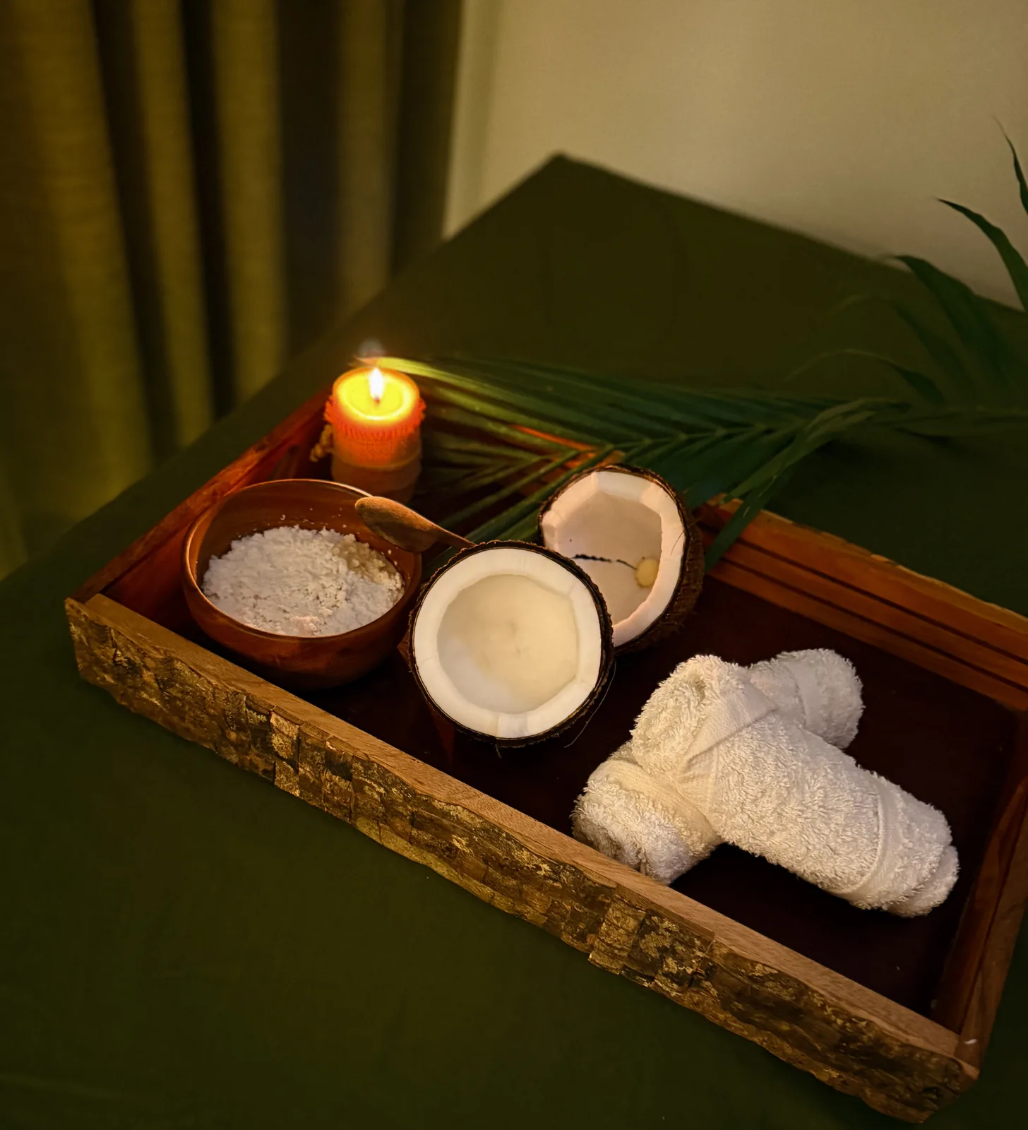 A real Shizen ritual tray with coconut, towels and candlelight